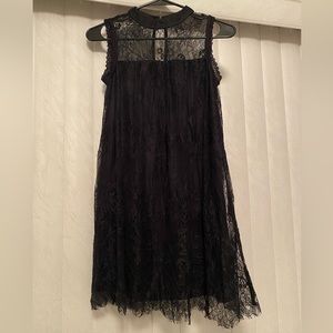 Black lacy dress (hits above the knee). Size: XS.